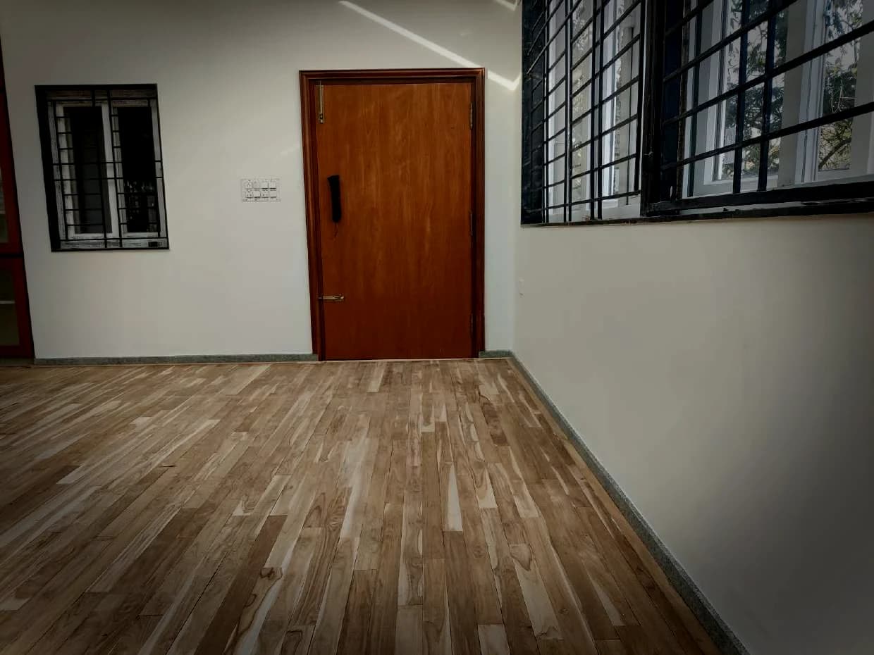 Finished timber floor running out to the doorway of a smaller room