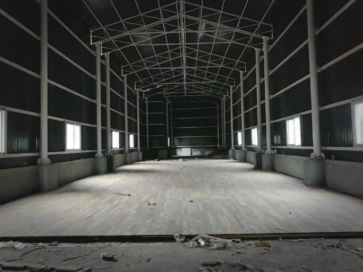 A hall fully decked in teak, before sanding and finish